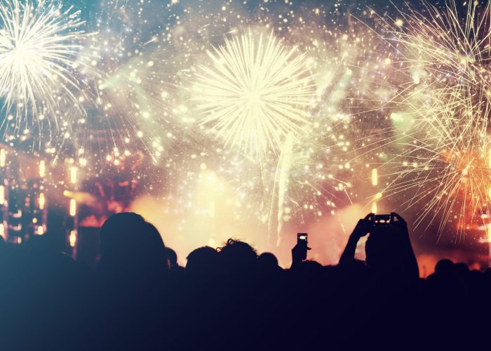 455785_gettyimages_622798210_cheering-crowd-and-fireworks-new-year-concept